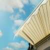 A retractable awning with blue sky behind it