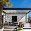 An outdoor patio with a pergola