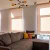 Motorized roller blinds in a sunny room