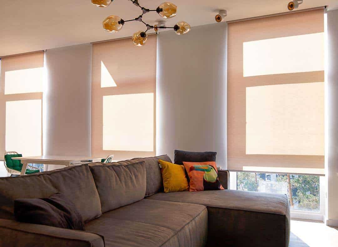 motorized-roller-blinds-in-a-sunny-room - Shade.Shop Motorized roller blinds in a sunny room