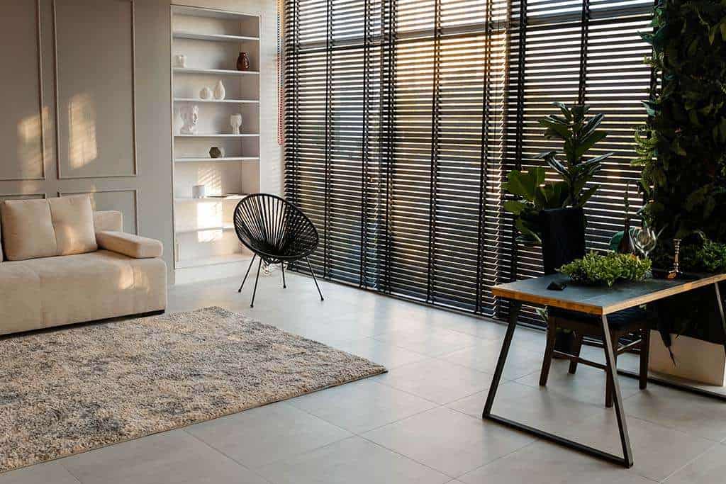 a-bright-modern-living-room-with-dark-window-blinds - Shade.Shop